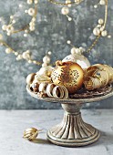 Vintage Christmas decorations on a cake stand