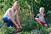 Mother and child at herbal harvest