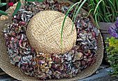 Straw hat with dried hydrangea flower wreath