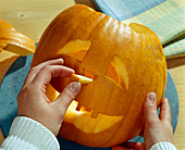 Hollow out the pumpkin, remove the face