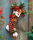 Santa stocking with branches and decoration