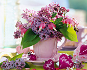 Pink cup with syringa (lilac)