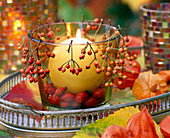Glass, filled and decorated with pink (rosehip) with ball candle