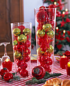 Tall glasses filled with red and green balls