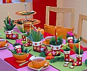 Table decoration with candle arrangement in porcelain St. Nikolaus boots