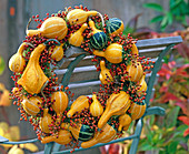 Wreath with ornamental pumpkins and rosehips