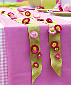 Ribbon covered with Bellis flowers
