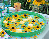 Rudbeckia Flowers, yellow floating candles in green tray