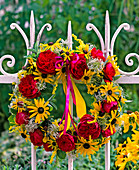 Red roses and rudbeckia wreath