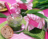 Pesto from Allium ursinum (wild garlic) in screw jars, bread