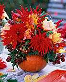 Autumn bouquet in pumpkin vase