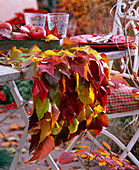 Table runner with wild wine autumn leaves