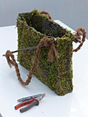 Moss bag with daffodil, moss bag with spring flowers