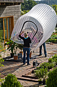 Inflatable greenhouse for wintering potted plants