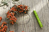 Wreath made of sea buckthorn and rowanberries