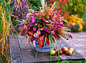 Autumn bouquet made of Aster (autumn chestnut), Amelanchier (rock pear)