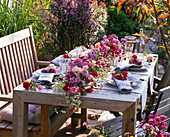 Table decoration with asters and roses