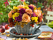 Autumn bouquet in cup from basket
