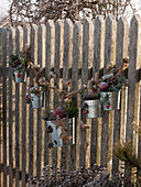 Wooden lath fence decorated for Christmas