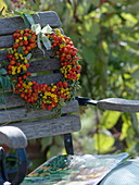 Late summer wreath of wild fruits and tansy