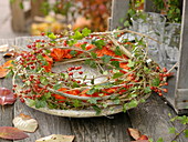 Autumn wreath of clematis, ivy and lanterns