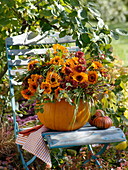 Bouquet in pumpkin as a vase