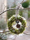 Snowy wreath of moss, decorated with Pinus cones