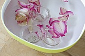Homemade ice wind lights with rose petals