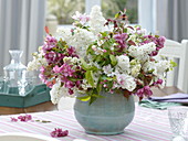 Fragrant spring syringa and malus branches bouquet