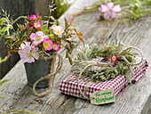 Small bouquet of pink (wild roses), wreath of grasses with pendant