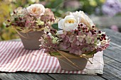 Small arrangements in clay pots, pink, hydrangea