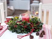 Wreath of Ilex (holly) with candle in the middle