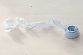 Rolled up gift ribbon for bows