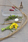 Easter window decoration with willow egg and daffodils