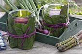 Preserving jars wrapped as lanterns with cabbage leaves