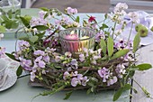 Romantic table decoration with perennial peas