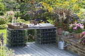 Home-built bench of gabions filled with empty bottles