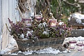Basket box planted with Erica carnea (snow heather), glasses as lanterns