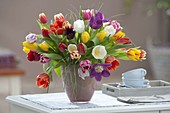 Colorful mixed Tulipa bouquet in glass vase