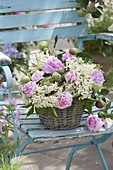 Fragrant arrangement in a basket: pink (roses), elderberry blossoms