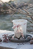 Frozen lantern with ribbon and heart