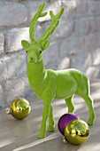 Green deer with Christmas baubles