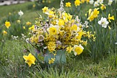 Yellow spring bouquet with daffodil and gold bells