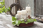 May green, stem pieces of betula (birch) as a candle holder