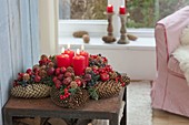 Pine cone star with fruits and berries as Advent wreath