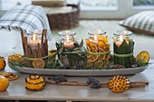 Fragrant Advent decoration, glasses with cinnamon sticks, Olea branches