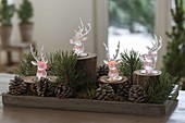 Christmas forest decoration with colored LED light deer