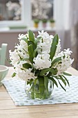 Small bouquet of Hyacinthus 'White Pearl' in glass vase