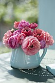 Small bouquet with ranunculus on terrace table