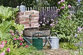 Water barrel and faucet for irrigation in the cottage garden